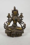 A Sino Tibetan gilt bronze female deity inset with semi precious stones, 8" high