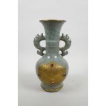 A Chinese celadon crackle glazed pottery two handled vase with applied gilt metal panels with