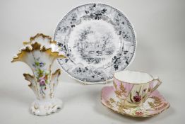 A mid C19th Staffordshire black transferware plate, with scalloped edges decorated with floral swags