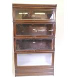 A 1930s Globe Wernicke bookcase, with four sections, a base and top, 34" x 12" x 60", one glass A/F