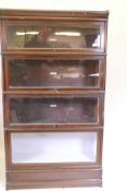 A 1930s Globe Wernicke bookcase, with four sections, a base and top, 34" x 12" x 60", one glass A/F