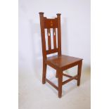 An Arts & Crafts oak hall chair, 41" high
