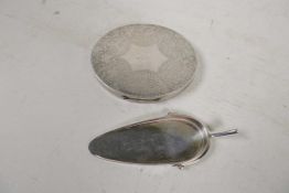 An Hermès, Paris, silver plated scoop modelled as a boot sole with spur, 4½? long, together with a