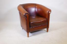 A brown leather club chair, 31" high