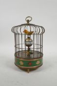 A brass bird cage automaton clock with cloisonne decoration, 8" high