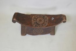 A large African hardwood New Guinea Sepik stool, 9" x 24½", A/F losses