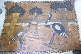 A hand decorated ethnic wall hanging depicting two birds and trees, 67" x 48"