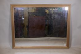 A gilt framed wall mirror with reed moulded frame