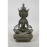 A Sino-Tibetan bronze four-faced deity with verdigris patina, 8½" high