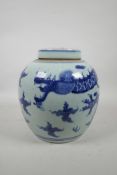 A Chinese blue and white porcelain ginger jar and cover decorated with a dragon and flaming pearl,