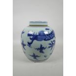 A Chinese blue and white porcelain ginger jar and cover decorated with a dragon and flaming pearl,