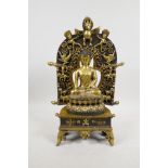 A Sino-Tibetan bronze Buddha and stand, double vajra mark to base, 14½" high