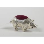 A sterling silver pincushion in the form of a pig, 1½" wide