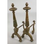 A pair of classical style brass fire dogs, 17" high, 8" deep