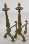 A pair of classical style brass fire dogs, 17" high, 8" deep