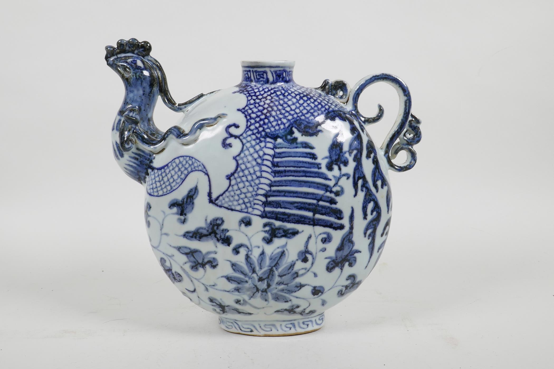 A Chinese blue and white porcelain phoenix pourer, 8" high