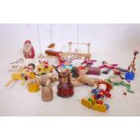 A quantity of children's wood toys, a spinning top, jigsaw and a Triang Wakouwa dog etc