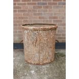 A large cast iron planter, loose base, 25½" high x 26½" diameter