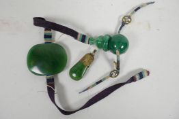 A Chinese green jade talisman pendant together with a jade lozenge pendant