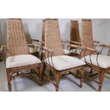 A set of six bamboo and wrought iron conservatory chairs with woven high backs, 42" high