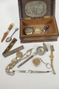 A studded oak trinket box containing miscellaneous items, wristwatches, silver plated albert,
