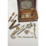 A studded oak trinket box containing miscellaneous items, wristwatches, silver plated albert,