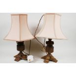 A pair of carved oak table lamps, 16" high including shades