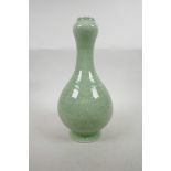 A Chinese green glazed porcelain garlic head shaped vase with phoenix underglaze decoration, six
