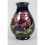 A late C20th Moorcroft pottery vase of bulbous form with floral decoration, 5½? high