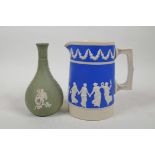 A Wedgwood green Jasperware bottle vase and a Copeland blue Jasperware jug, largest 5½" high