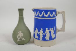 A Wedgwood green Jasperware bottle vase and a Copeland blue Jasperware jug, largest 5½" high
