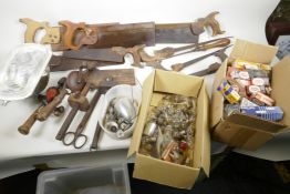 A quantity of vintage woodworking tools including tenon and pad saws, plus hand drills, blow lamps
