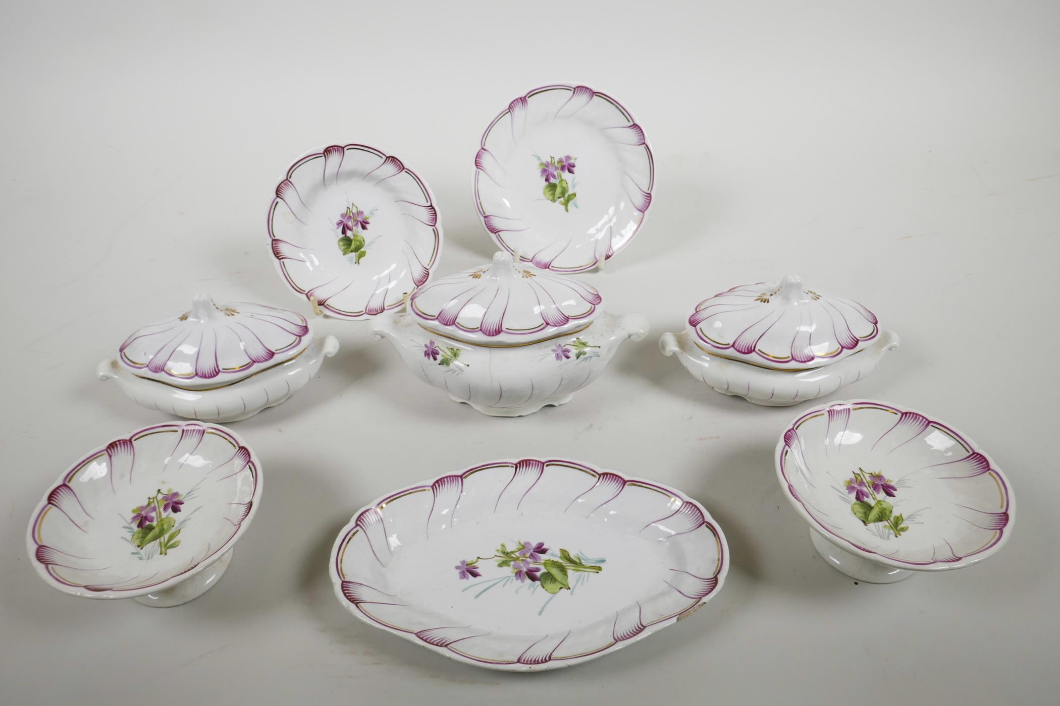 A late C19th Continental child's miniature porcelain part dinner service with scalloped rims and