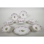 A late C19th Continental child's miniature porcelain part dinner service with scalloped rims and