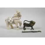 An Indian sectional bone figure of a horse, together with a brass padlock in the form of a lion,