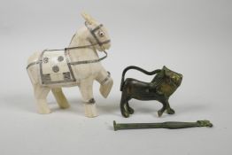 An Indian sectional bone figure of a horse, together with a brass padlock in the form of a lion,