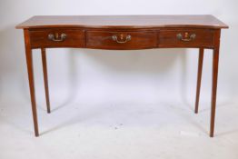 A C19th mahogany serpentine front three drawer serving table, with original brass swan neck handles,