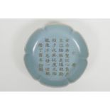 A Chinese Ru ware style porcelain dish with a shaped rim and chased and engraved character
