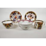 An 1800-1825 Derby Imari style London shape tea cup and coffee can with two saucers, hand painted in