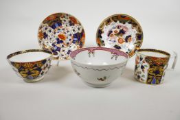 An 1800-1825 Derby Imari style London shape tea cup and coffee can with two saucers, hand painted in