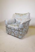A Wesley Barrell armchair upholstered in a floral silk