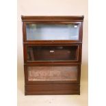 A Globe Wernicke bookcase, with three sections, base and top, one section lacks scissor action,