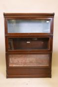 A Globe Wernicke bookcase, with three sections, base and top, one section lacks scissor action,