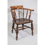 A C19th beech smoker's bow chair, with saddle shaped elm seat