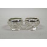 A pair of cut glass and hallmarked silver salts, marked Birmingham 1943