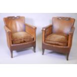 A pair of 1930s Continental leather easy chairs, with sprung seats and brass stud decoration, raised
