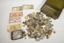 A tin of (detectorist finds) 6p pieces together with a cash box containing World coins and banknotes