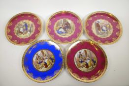 A set of five Bavarian porcelain wall plates with gilt borders from Josef Kuba decorated with