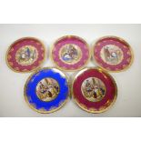 A set of five Bavarian porcelain wall plates with gilt borders from Josef Kuba decorated with