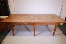 A French style fruitwood farmhouse table, raised on six square tapering supports, 43" x 103" x 29½?